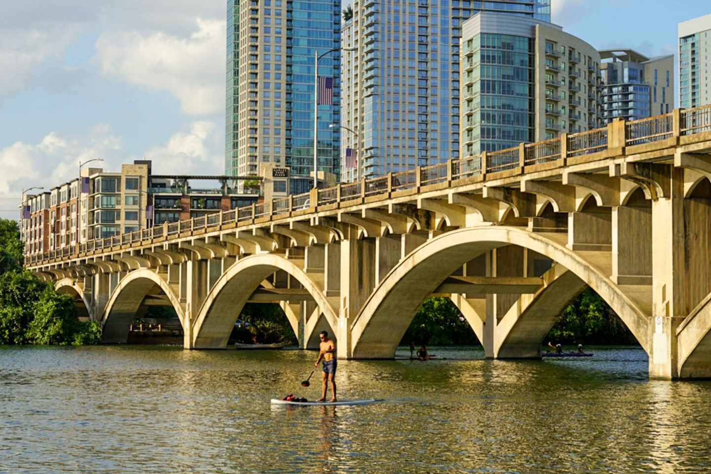 Paddleboarding on Lady Bird Lake below the Austin skyline, Texas