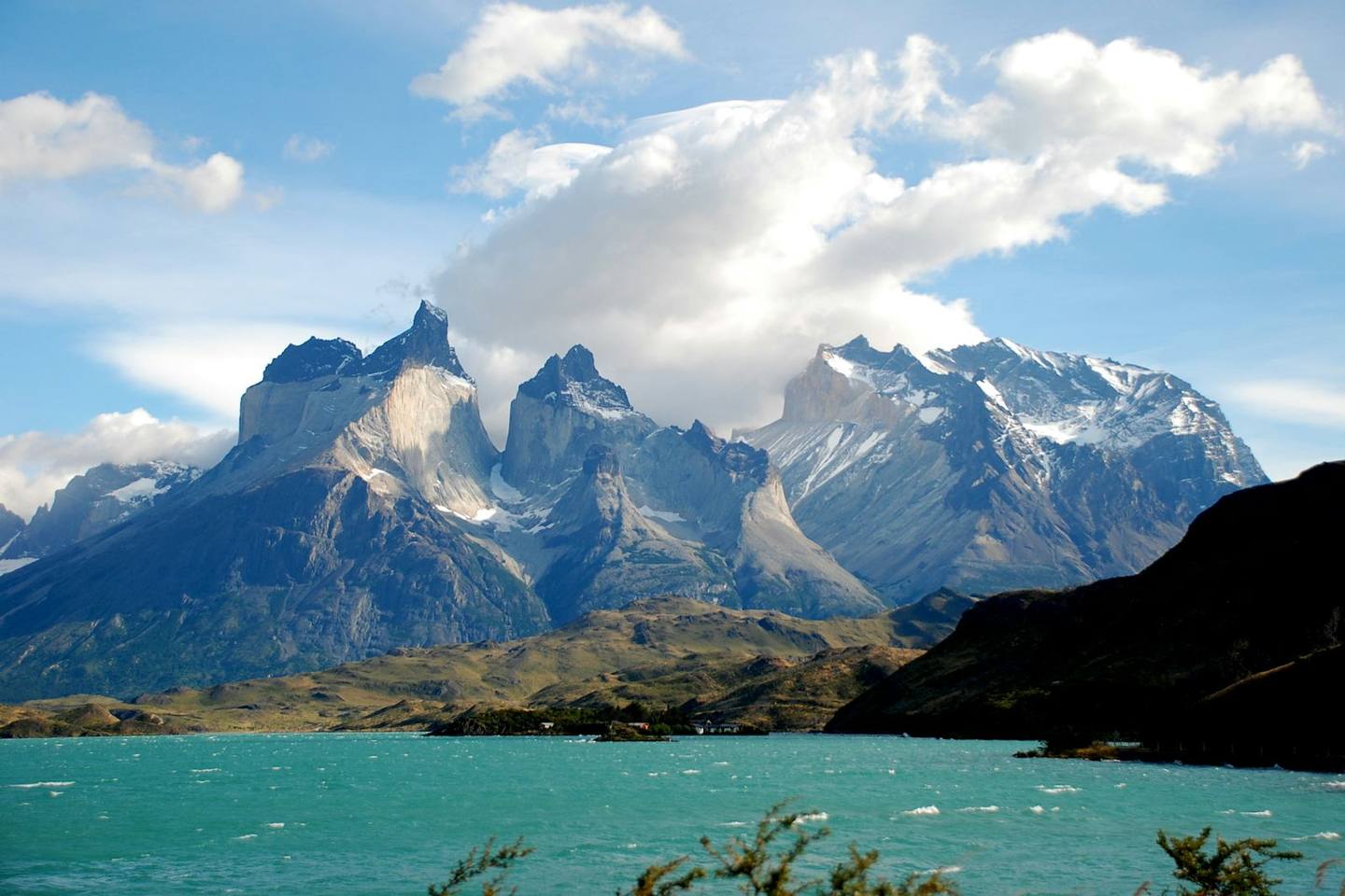 The peaks of Torres del Paine above a turquoise lake, Chile