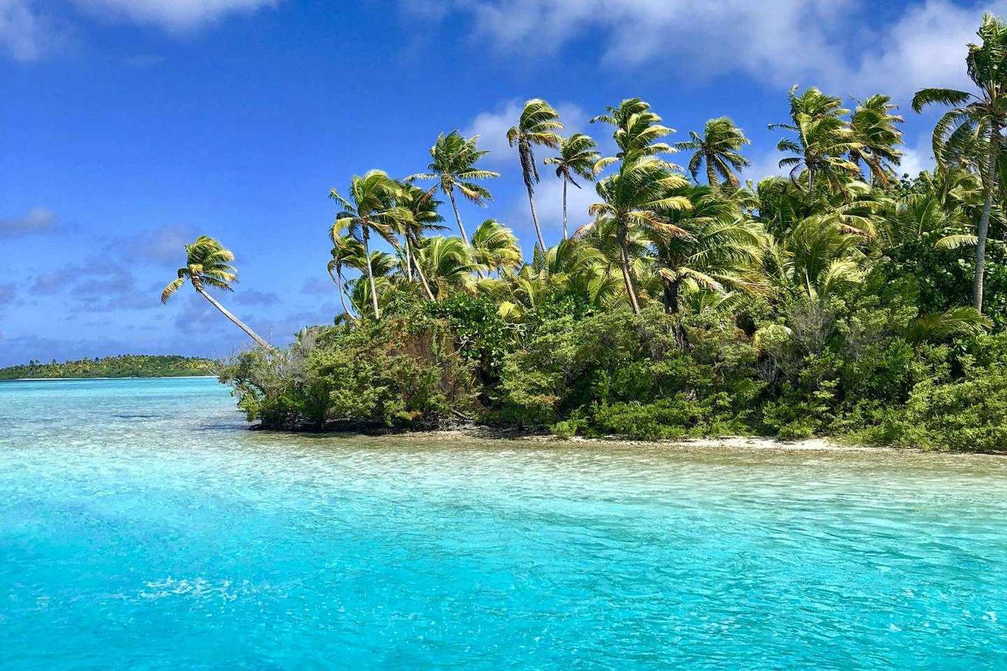 A tropical island lagoon with turquoise water
