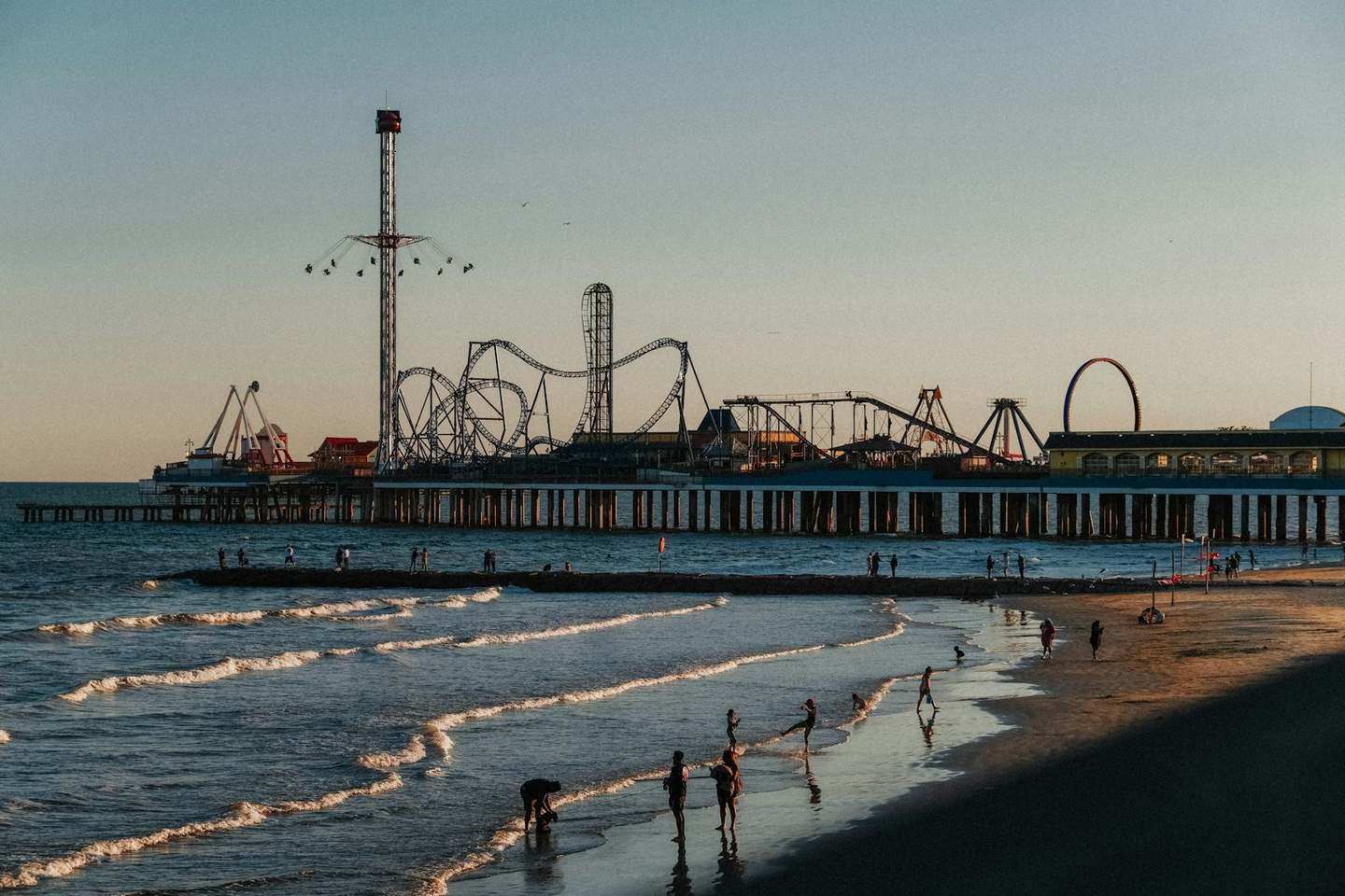 The Pleasure Pier at sunset in Galveston, Texas