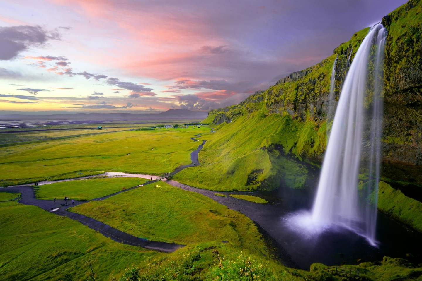 Seljalandsfoss waterfall at sunset in Iceland