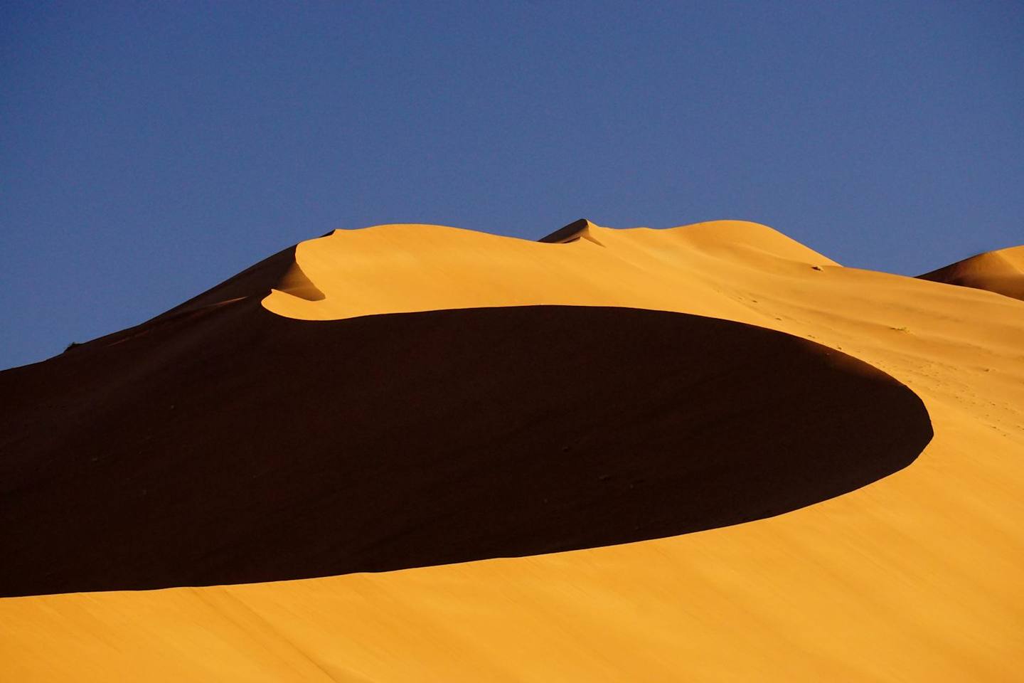 Towering red sand dunes at Sossusvlei, Namibia